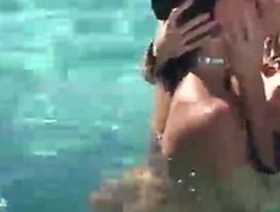 Two girls playing rough on a poolside bp-1-05
