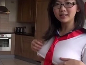 Young Japanese girl indulging in self-pleasure with sex toys