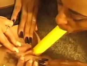 Three excellent ebony sluts are licking pussies and playing bright yellow toy